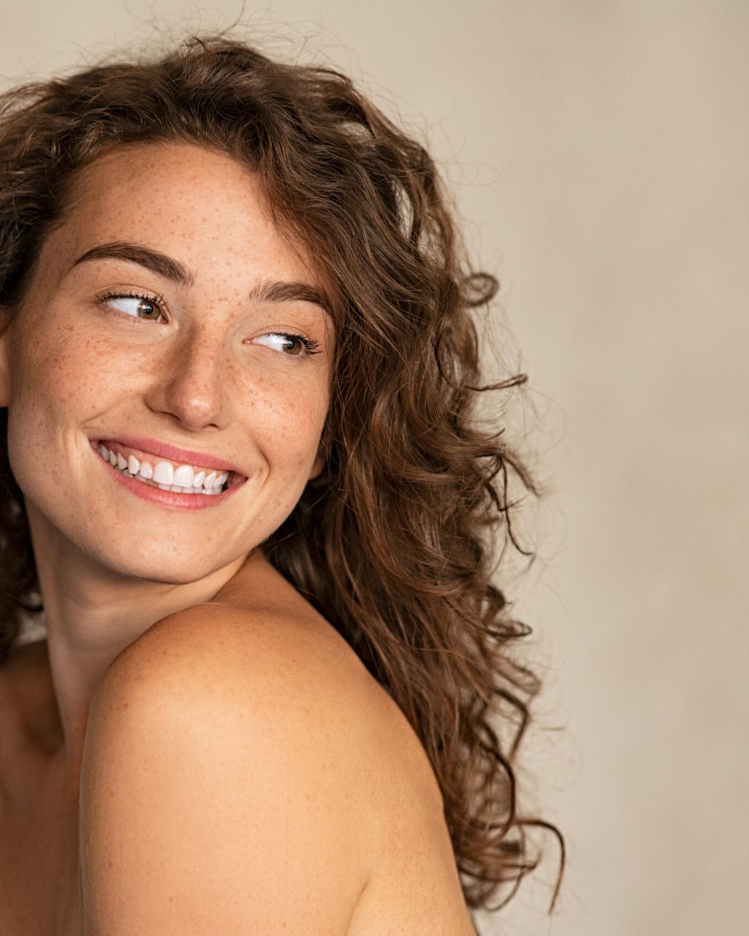 Portrait,Of,Smiling,Girl,Enjoying,Beauty,Treatment,On,Beige,Background.